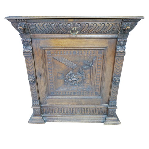 186 - A Flemish 19th century carved oak cabinet, with carved cornice and lions head mounts, the top sectio... 