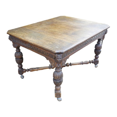 187 - A Flemish 19th century oak dining table, rectangular surface, carved decoration, raised on baluster ... 