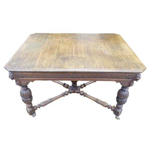 187 - A Flemish 19th century oak dining table, rectangular surface, carved decoration, raised on baluster ... 