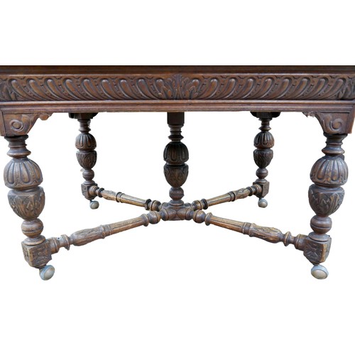 187 - A Flemish 19th century oak dining table, rectangular surface, carved decoration, raised on baluster ... 