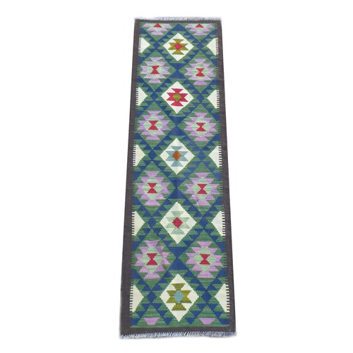 175 - A Maimana Kilim runner, with diamond patterned of blue, purple, green, and cream, encased in a brown... 