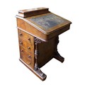A Victorian walnut Davenport, with marquetry inlaid top, a leather inset to its writing slope, a/f, ... 