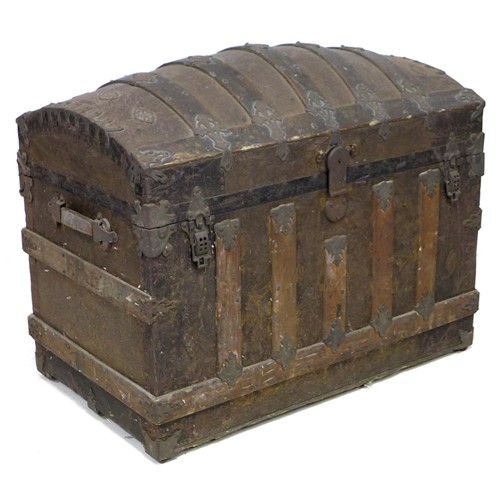 170 - A 20th century dome topped storage chest, with wooden supports and embossed with metal decorative ap... 