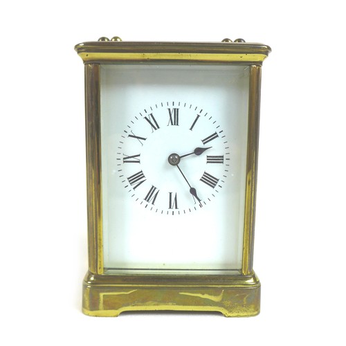 92 - A 20th century brass carriage clock, with enamel dial and Roman numerals, blued steel hands, five gl... 