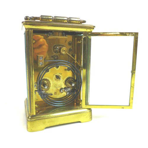 92 - A 20th century brass carriage clock, with enamel dial and Roman numerals, blued steel hands, five gl... 