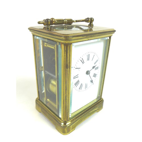 92 - A 20th century brass carriage clock, with enamel dial and Roman numerals, blued steel hands, five gl... 