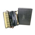 A vintage Frontalini piano accordion, with original fitted case.