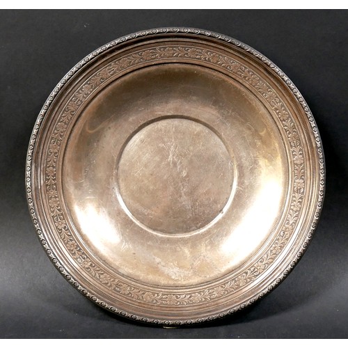 10 - An American Sterling silver dish, circular form with cast floral decoration to the borders, stamped ... 