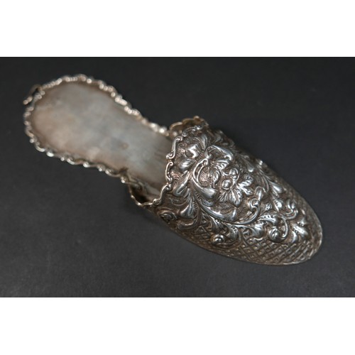 39 - A late Victorian novelty silver hanging wall pocket, in the form of a slipper, with embossed floral ... 