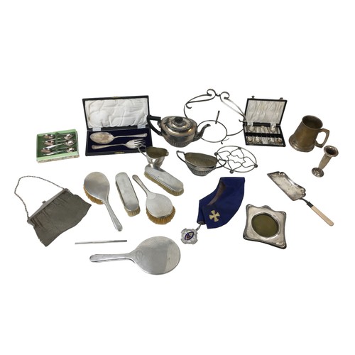 11 - A collection of silver and silver plated wares, including a silver backed dressing table set, a silv... 