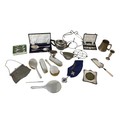 A collection of silver and silver plated wares, including a silver backed dressing table set, a silv... 