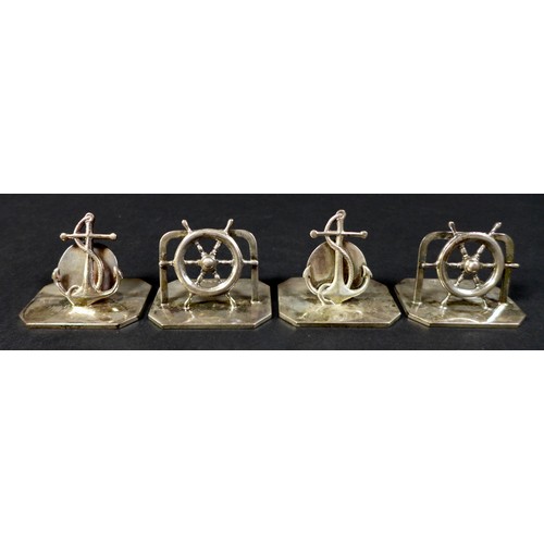 40 - Four silver nautical menu holders by Harrods of London, two anchors, two ship's wheel, approximately... 