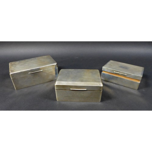 37 - A group of three Edwardian silver cigarette boxes, machine turned decorations to lid, with cedar woo... 