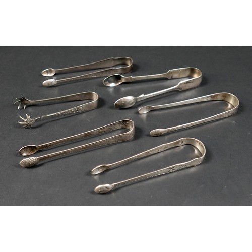 15 - A group of six 18th and 19th century silver sugar tongs, including bright cut engraved and claw foot... 