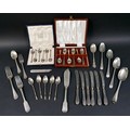 A group of mixed silver flatware, including two cased sets of coffee spoons, and a butter spreader, ... 