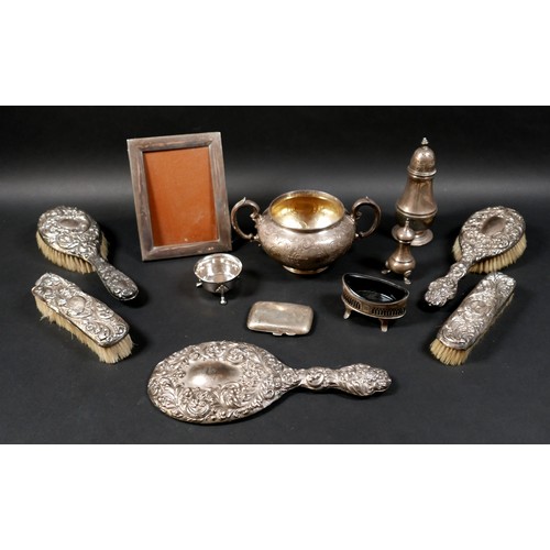 60 - A group of mixed silver items, including a twin handled bowl, sugar caster, pepper, three legged sal... 