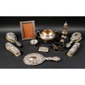 A group of mixed silver items, including a twin handled bowl, sugar caster, pepper, three legged sal... 