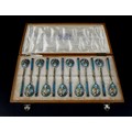 A cased set of pre-revolution Russian enamelled teaspoons, with polychrome enamel decoration and gil... 