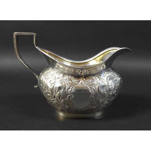 58 - A Victorian three piece silver tea set, comprising a teapot, 27 by 11 by 15.5cm high,milk jug and su... 