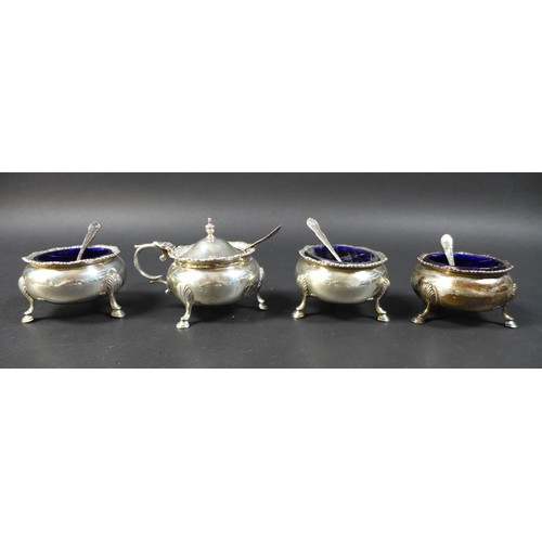 56 - A group of George V and later silver, including four cauldron cruets, with blue glass liners, all wi... 