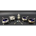 A group of George V and later silver, including four cauldron cruets, with blue glass liners, all wi... 