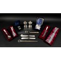 A collection of ERII silver, including a pair of napkin rings with case and still in plastic wrappin... 