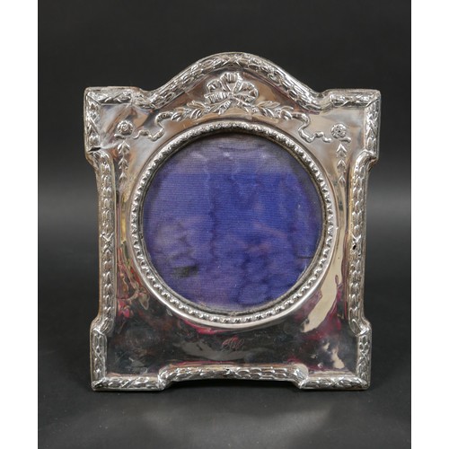 33 - Six Edwardian and later silver photograph frames, including an Edwardian frame with ribbon deocratio... 