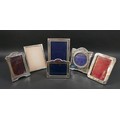 Six Edwardian and later silver photograph frames, including an Edwardian frame with ribbon deocratio... 