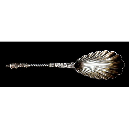 26 - A cased set of four Victorian silver decorative serving spoons, with scalloped bowls, twist stems an... 