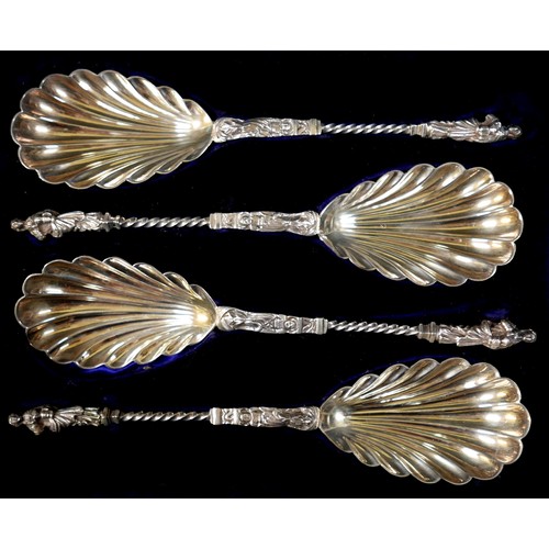 26 - A cased set of four Victorian silver decorative serving spoons, with scalloped bowls, twist stems an... 