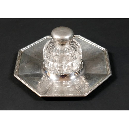 27 - A Victorian silver inkwell, with octagonal dish stand, cut glass bottle and hinged cover, Henry Wilk... 