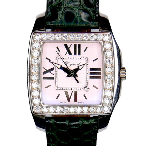 A Chopard diamond set lady's 'Two O Ten Tycoon' stainless steel wristwatch, model 8464, circa 2009, tonneau shaped case with pale pink dial, silvered oversize cardinal Roman numerals, date aperture, arrow hands, centre seconds, the bezel set with thirty eight round cut diamonds, each 2.0mm, 0.03ct, approximately 1.14ct total diamond weight, quartz movement, signed to the dial and to the case back, numbered 1334657 and 8464, on a green crocodile skin strap with Chopard deployment clasp, dial 21mm, case 34mm, 65.2g gross.
Notes: not in working condition, suspect flat battery, but hands and date set well.