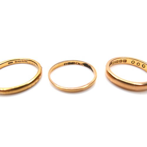 245 - A group of five 22ct yellow gold wedding band rings, comprising one 2.1mm wide, size L/M, 2.9g, one ... 