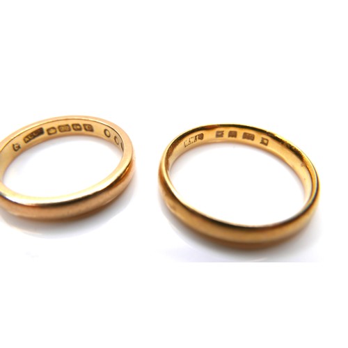 245 - A group of five 22ct yellow gold wedding band rings, comprising one 2.1mm wide, size L/M, 2.9g, one ... 