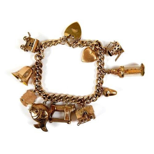 242 - A 9ct gold charm bracelet, with heart shaped padlock clasp, fitted with ten charms, 41.8g.