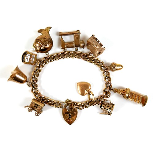 242 - A 9ct gold charm bracelet, with heart shaped padlock clasp, fitted with ten charms, 41.8g.