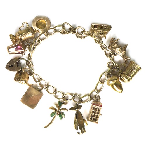 243 - A 9ct gold charm bracelet, with padlock clasp and safety chain, 37.1g overall, chain length 18cm.