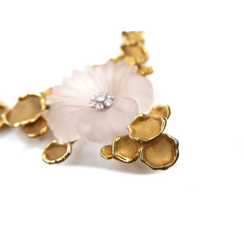 255 - An 18ct yellow gold necklace, in the style of Van Cleef & Arpels, formed as a pale pink frosted glas... 