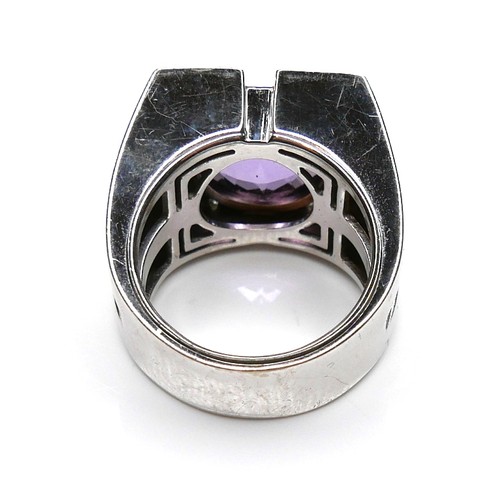 252 - A Versace 18ct white gold ring, set with a circular faceted cut amethyst, 13.5 by 7.5mm, within diam... 