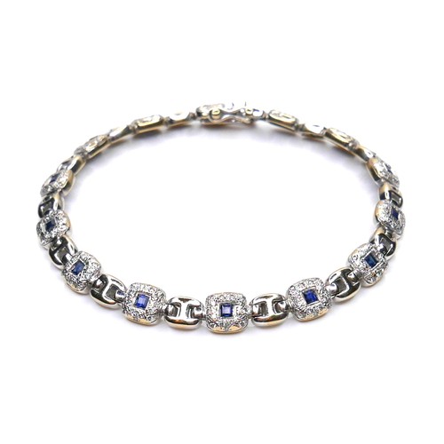 250 - An 18ct white gold, sapphire and diamond bracelet, fourteen cushion shaped panels, each set with a s... 