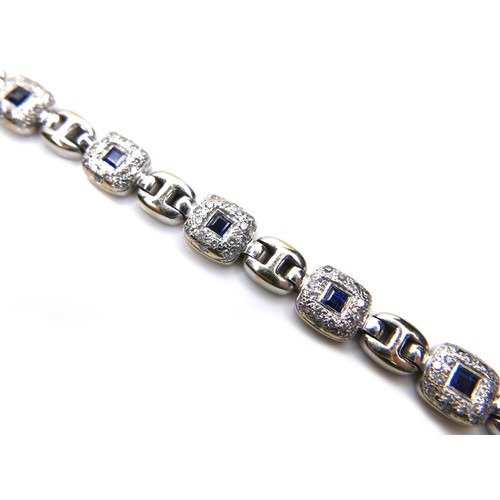 250 - An 18ct white gold, sapphire and diamond bracelet, fourteen cushion shaped panels, each set with a s... 