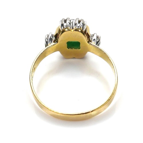 253 - An 18ct gold, emerald and diamond ring, the central Colombian emerald cut stone of of approximately ... 