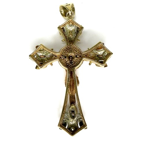 244 - A 14k yellow, rose, and white gold crucifix pendant, set with four diamonds to each arm, surrounding... 