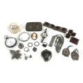 A collection of silver and white metal, including a silver ingot pendant with silver chain necklace,... 