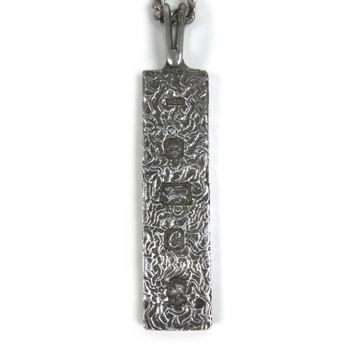 4 - A collection of silver and white metal, including a silver ingot pendant with silver chain necklace,... 