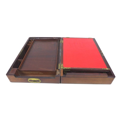 72 - A Georgian mahogany writing slope, with secret drawer and brass campaign handles, 44 by 29 by 13.5cm... 