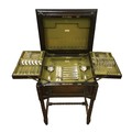 An early 20th century oak canteen with double hinged top section, containing a part set of silver pl... 