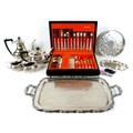 A group of silver plate wares, including a canteen of cutlery, twin handled tray, and a part tea ser... 