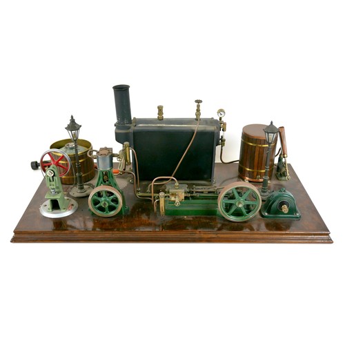 107 - A live steam engine display layout, mounted to a wooden base, with Stuart horizontal single piston e... 