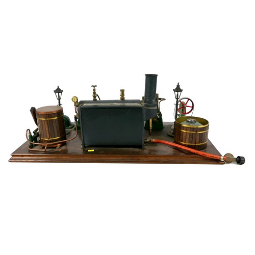 107 - A live steam engine display layout, mounted to a wooden base, with Stuart horizontal single piston e... 